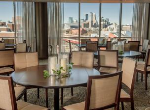 View from the Campus Club dining room featuring luxury furnishings and a view of the Minneapolis skyline