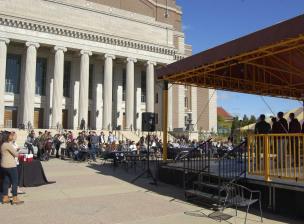 Outdoor space in front of Northrop Auditorium set up for an event with seating and sheltered stage area