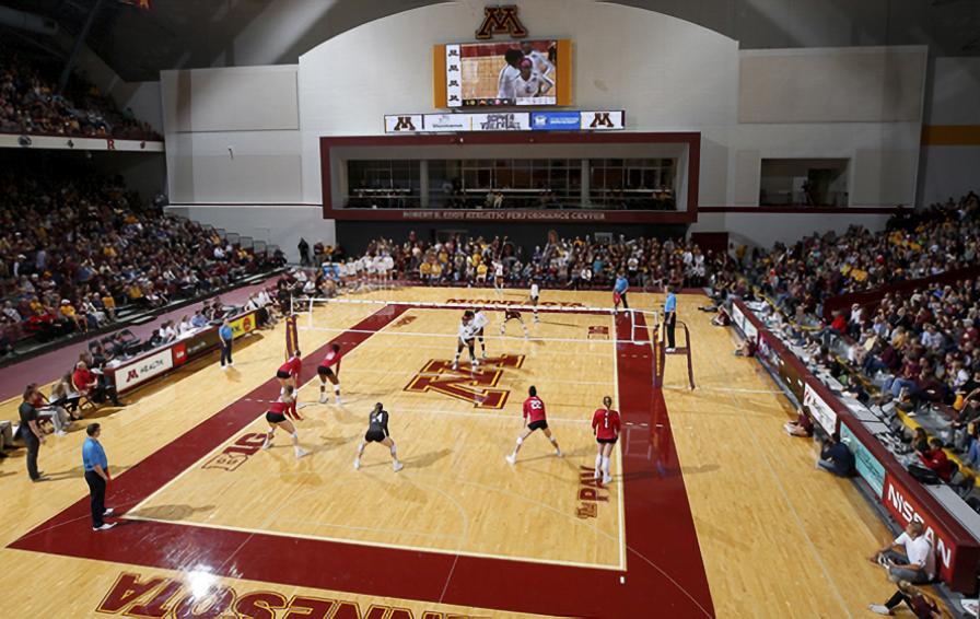 Interior of the Maturi Sports Pavilion - a volleyball game plays on the hardwood court